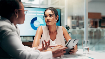 Health Communication - co-workers talking at a table