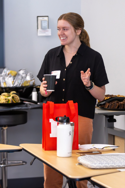 Student with a coffee in hand