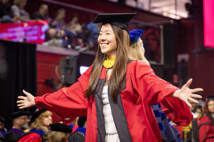 Student walking at convocation