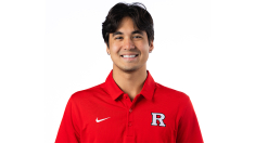 In this headshot, SC&I communication major Sean Abramik is smiling at the camera. He is wearing a red polo with a Rutgers R on it.  
